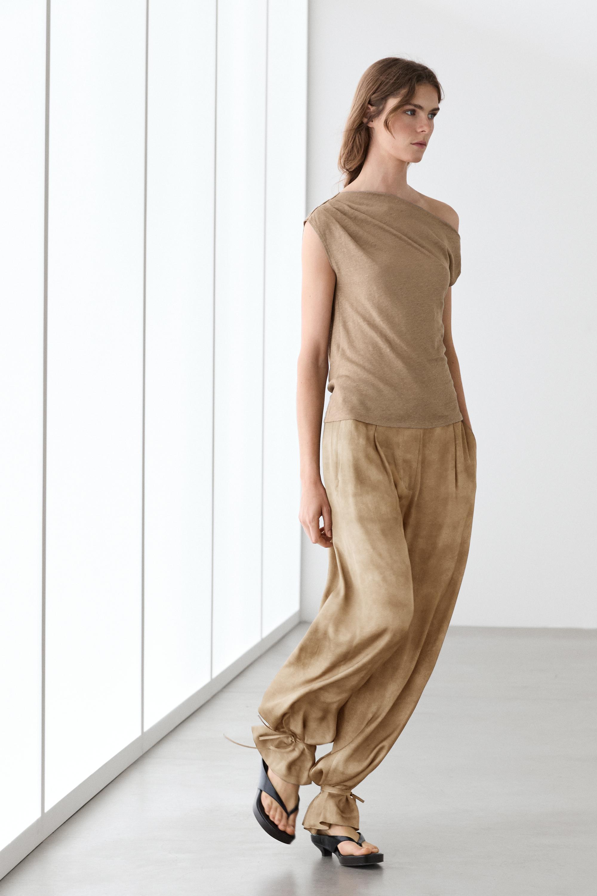 Asymmetric linen blend top with draped detail